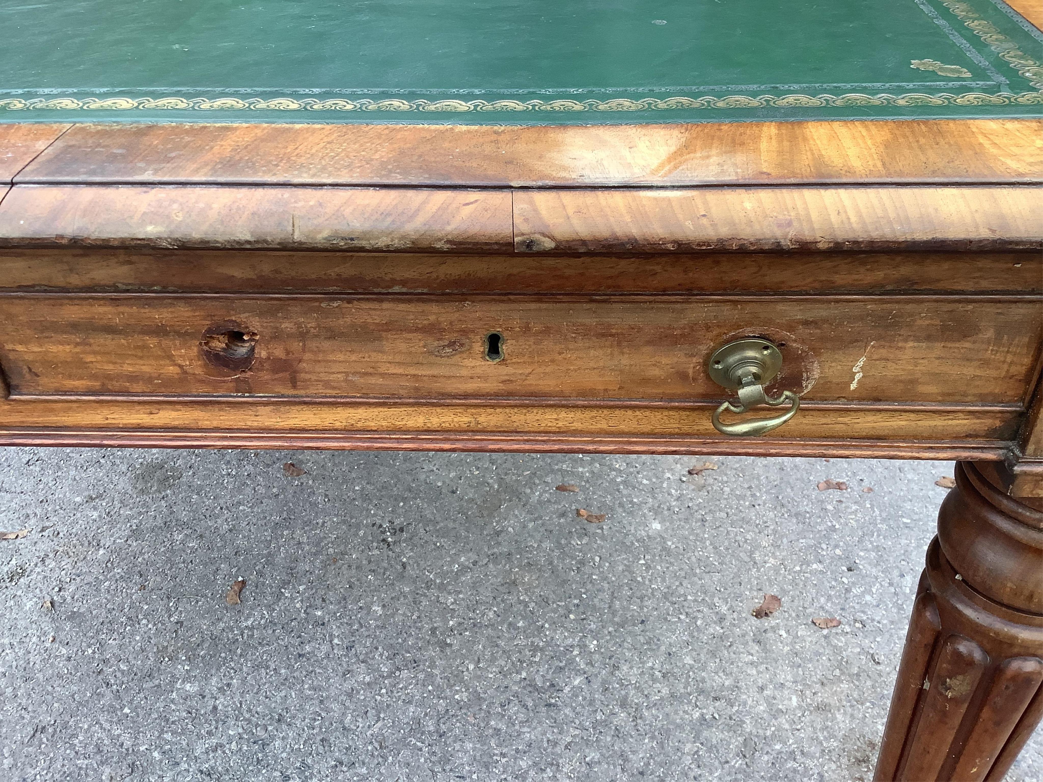 An early Victorian mahogany library table fitted four drawers, width 160cm, depth 130cm, height 78cm. Condition - fair